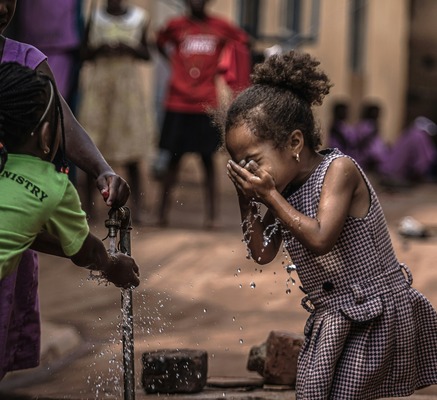 Young girl drinking water
